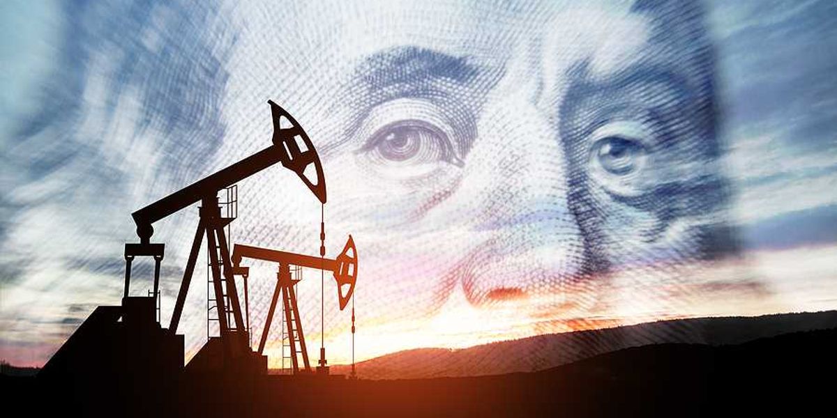 Oil pump jacks with an image of Benjamin Franklin in the background
