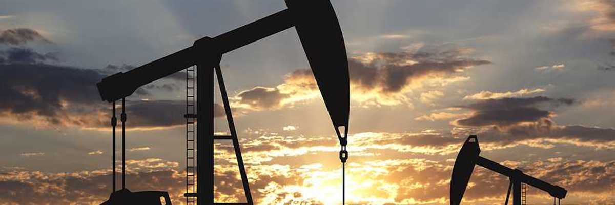 Oil pump oil rig energy industrial machine for petroleum in the sunset background