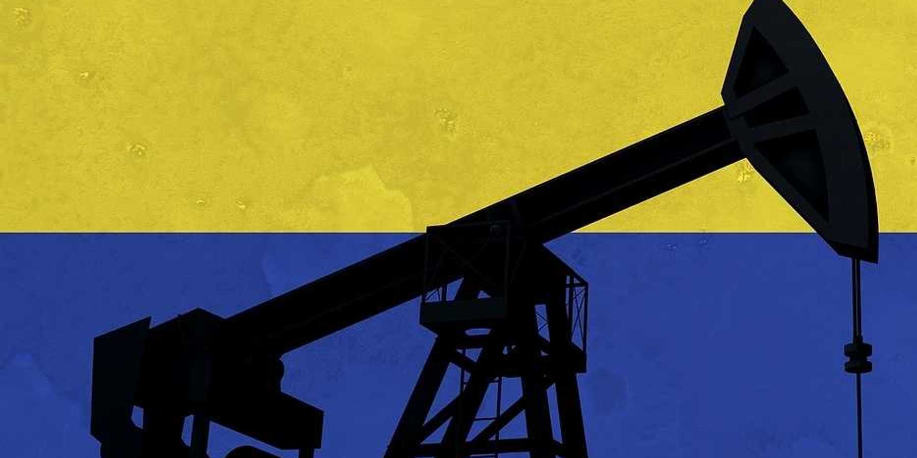 Oil pump silhouette against Colombia flag.