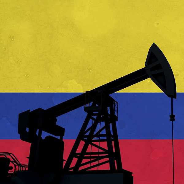 Oil pump silhouette against Colombia flag.