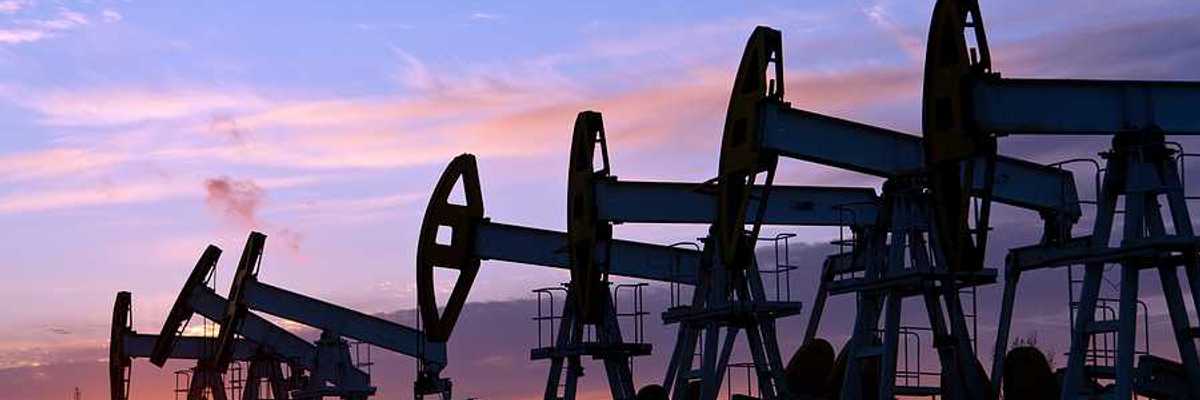 Oil pumps against a sunset sky background