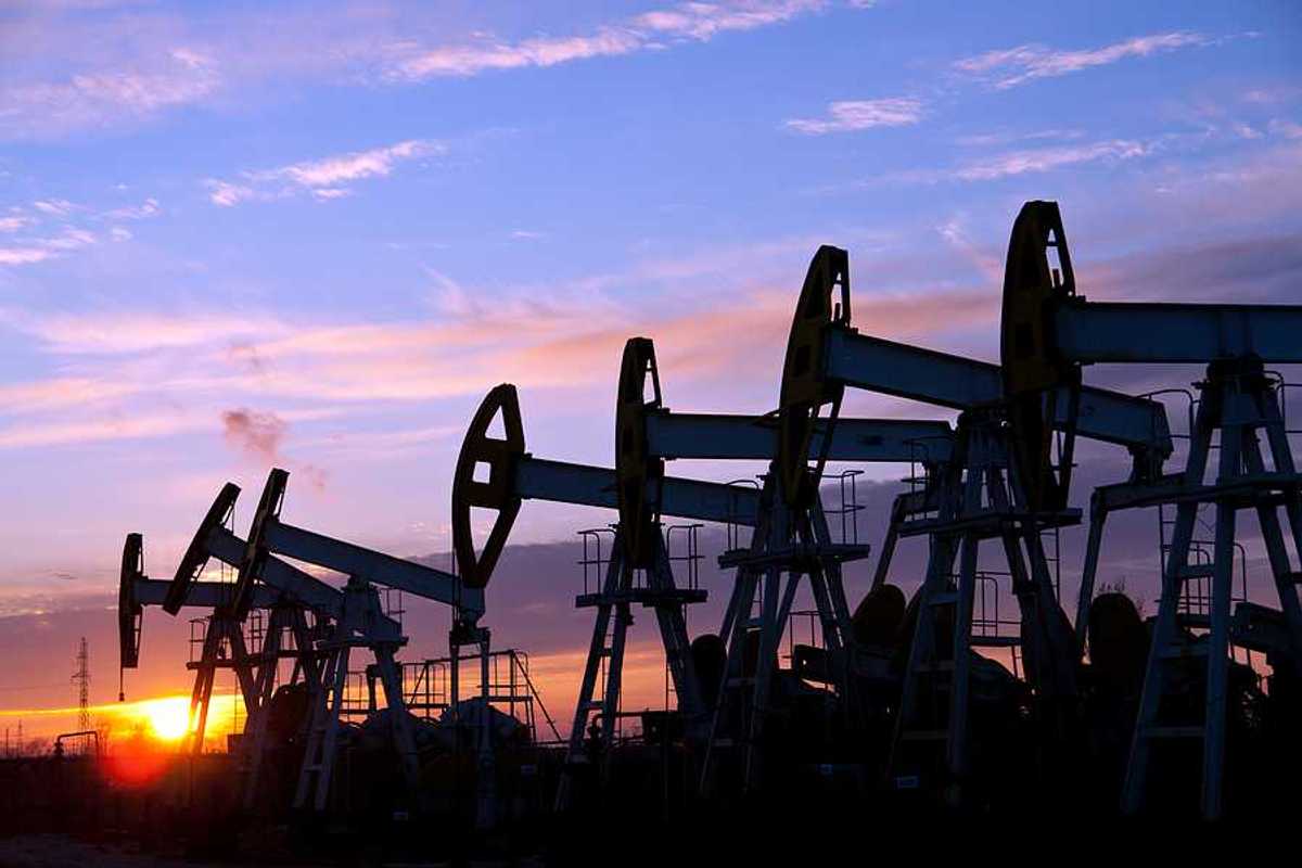 Oil pumps against a sunset sky background