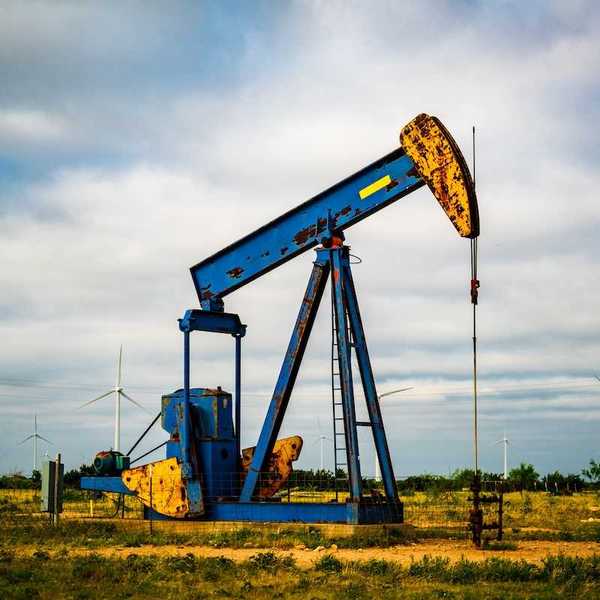 Oil rig pumping out fracked Natural gas in West Texas
