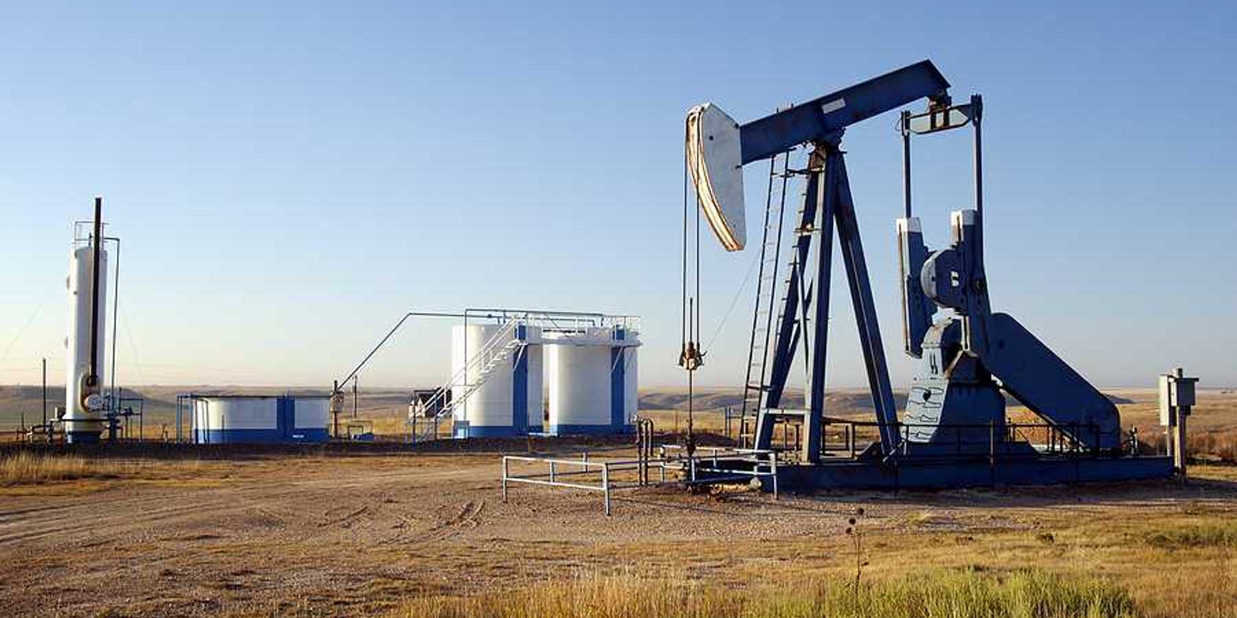 Oil well and storage tanks in the Texas panhandle.