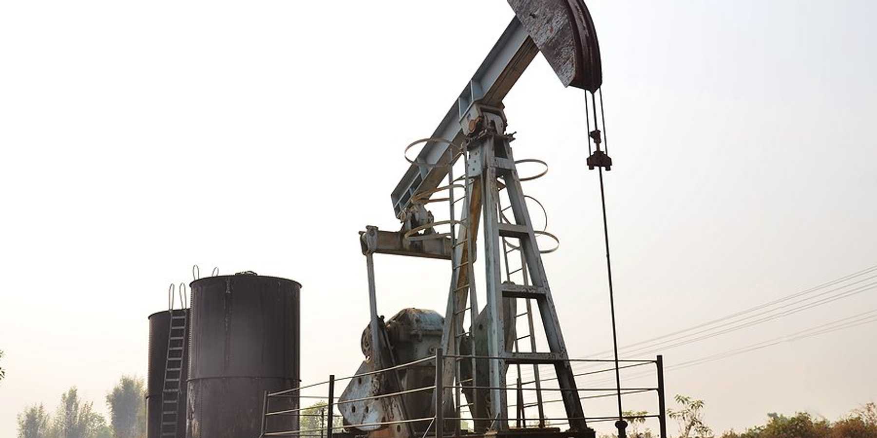 Oil well pump jack on a smoky day.