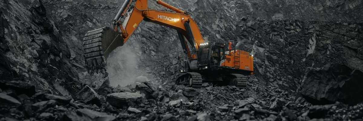 Orange Hitachi excavator working a coal mine.