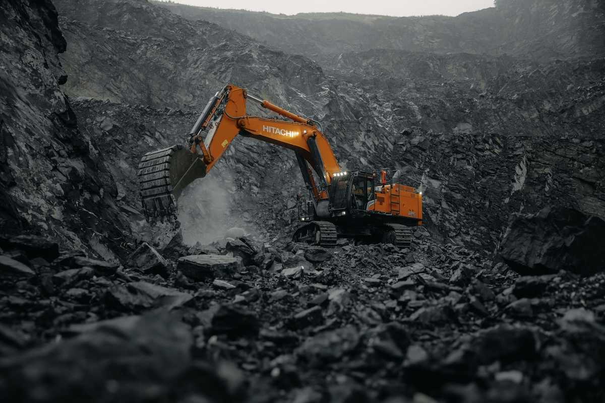 Orange Hitachi excavator working a coal mine.