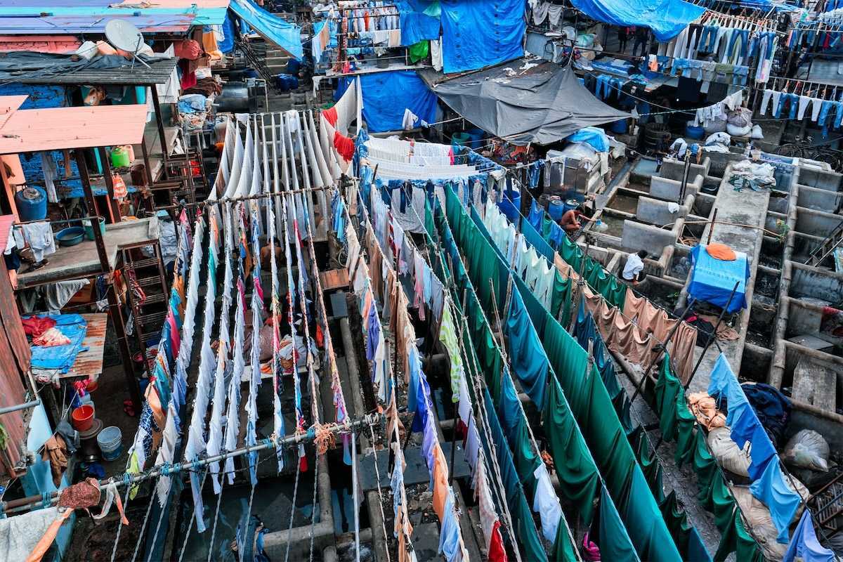 Outdoor textile market. Many textiles hanging on multiple lines