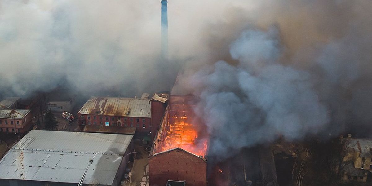 Overhead view of fire at factory buildings.