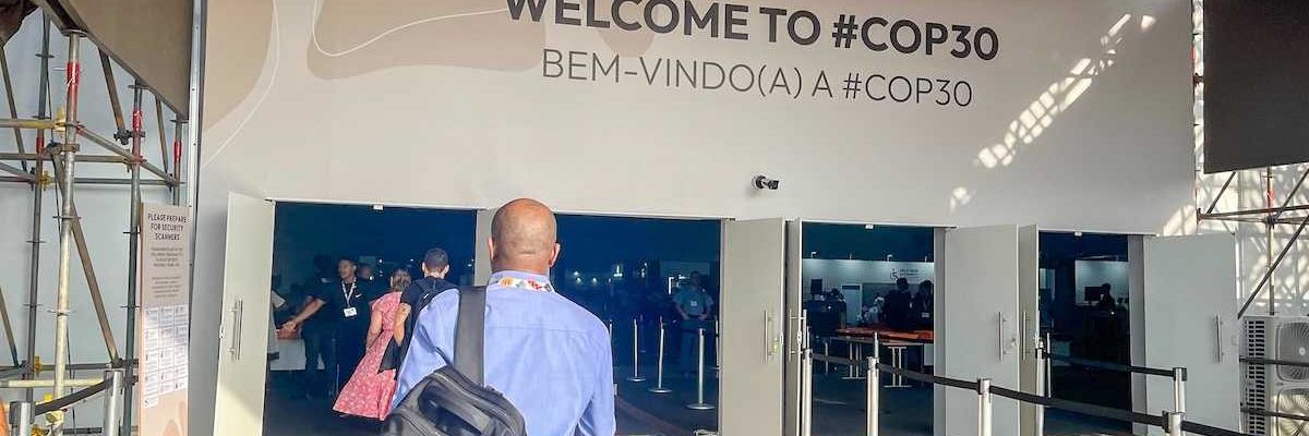 participants at the entrance to COP 30 pavilion