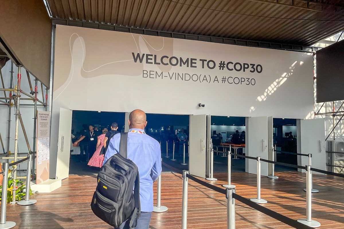 participants at the entrance to COP 30 pavilion