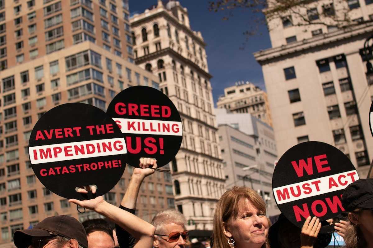 Peaceful protestors against greed and urging action