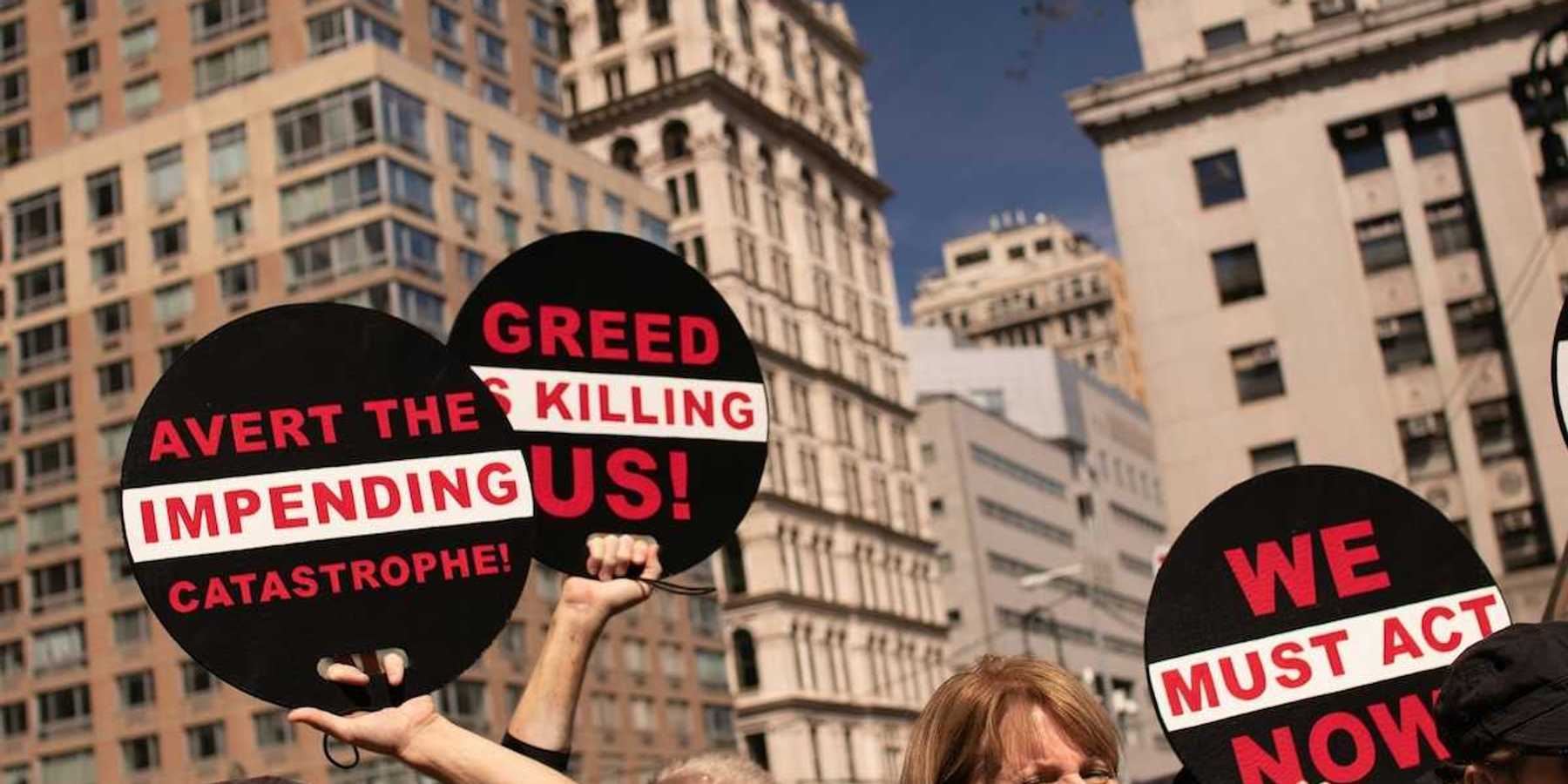 Peaceful protestors against greed and urging action