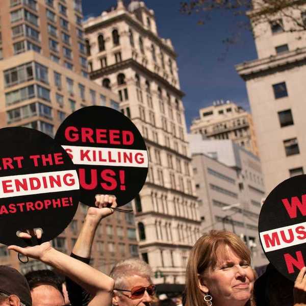 Peaceful protestors against greed and urging action
