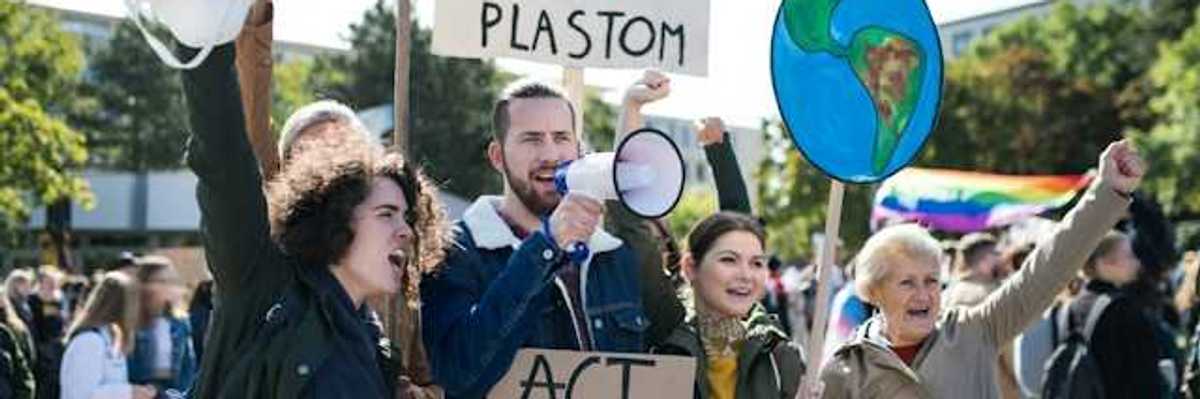 People with signs at a climate protest