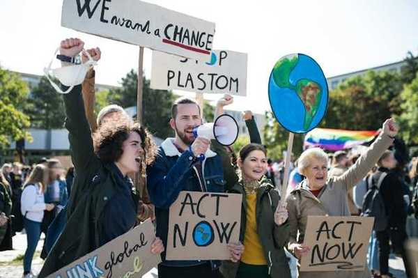 People with signs at a climate protest