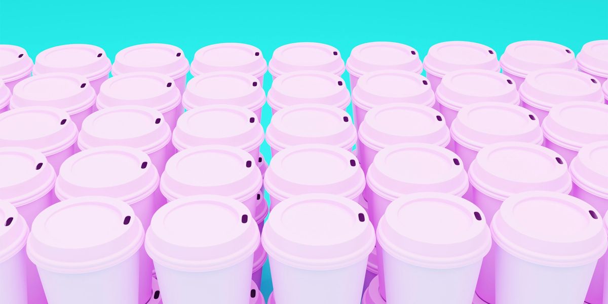 pink plastic travel mugs stacked in rows with a pale blue background.