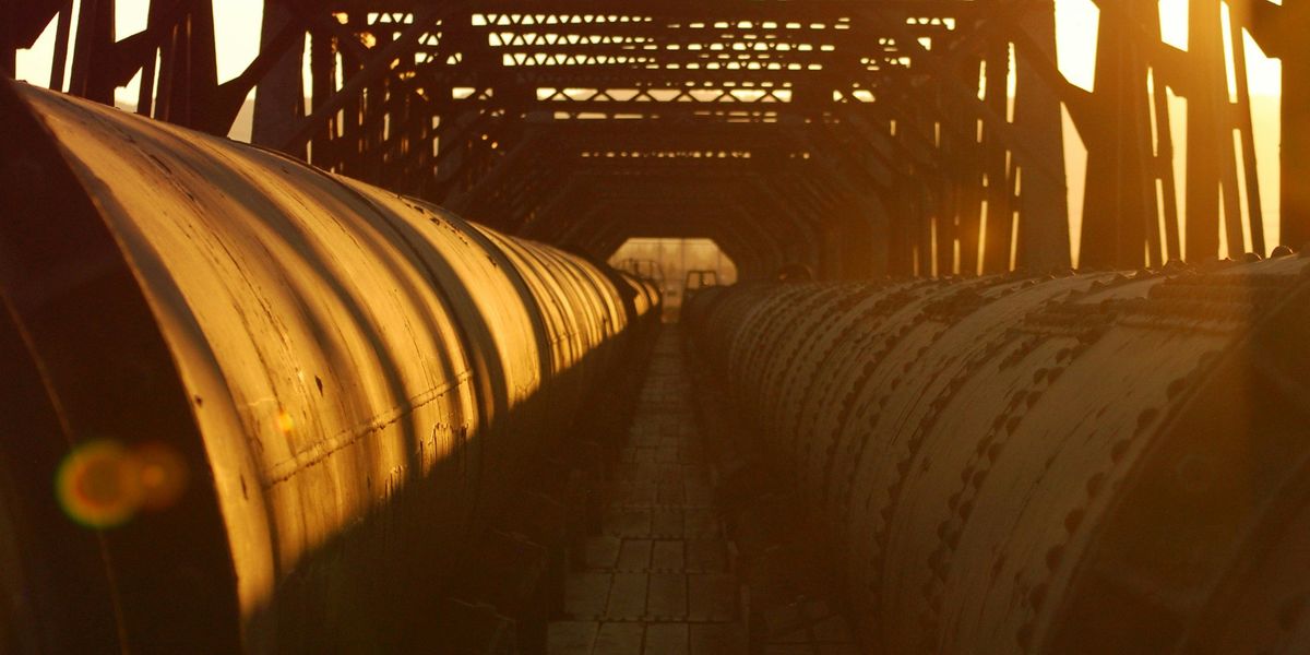 Pipelines stretching out over a bridge.