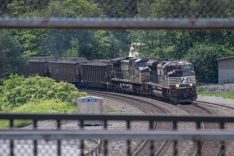 Outside a coal and steel conference, residents rally against pollution