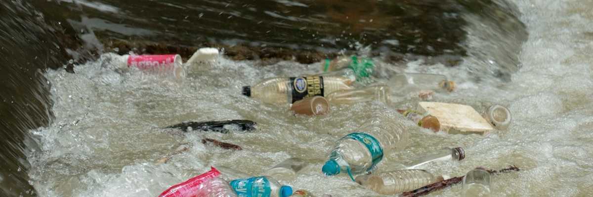 plastic trash bobbing in a river