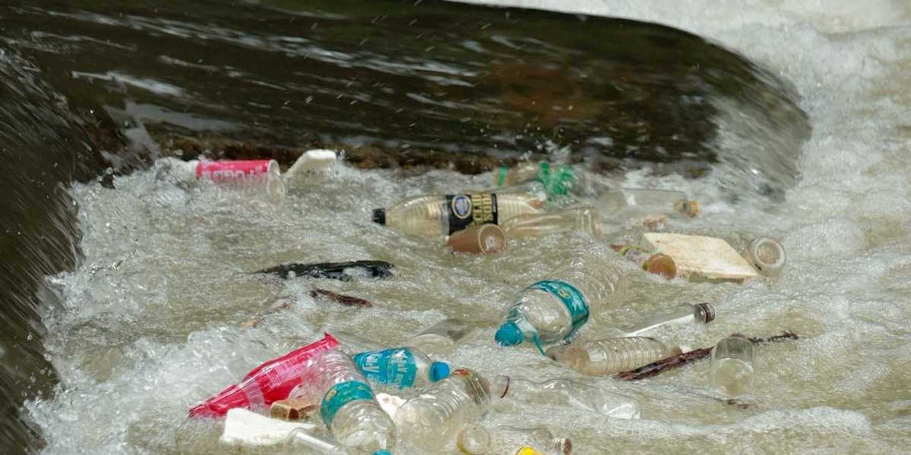 plastic trash bobbing in a river