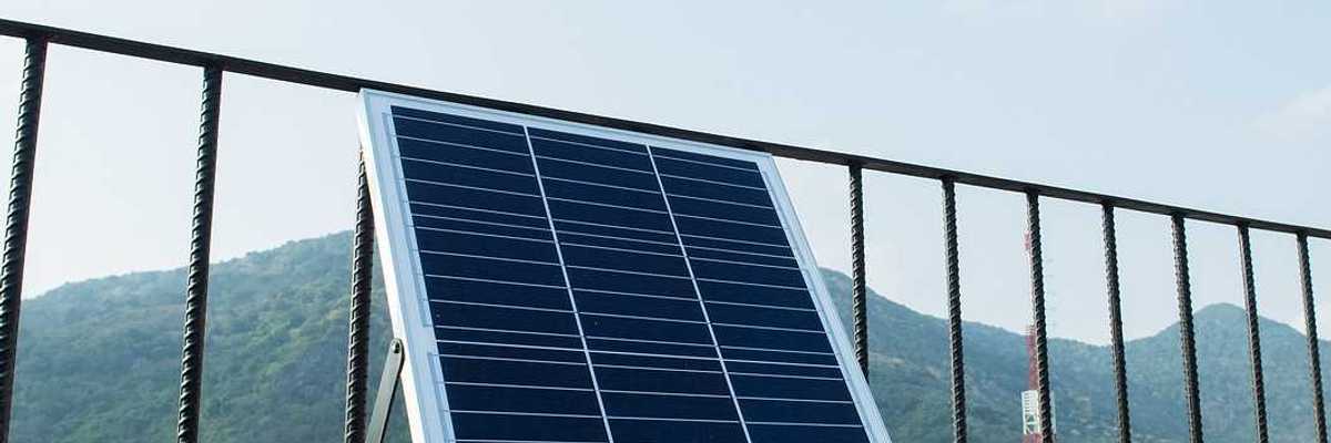 Plug-in solar panels mounted on a balcony terrace.
