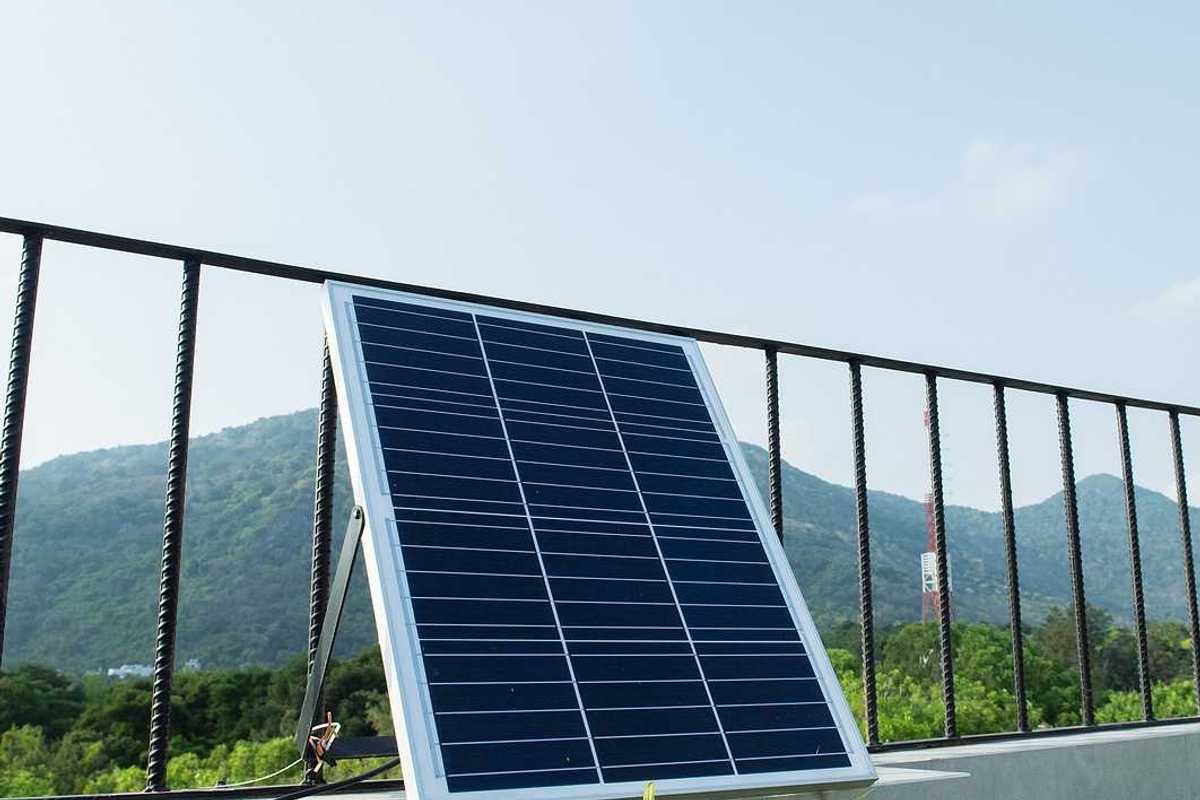 Plug-in solar panels mounted on a balcony terrace.