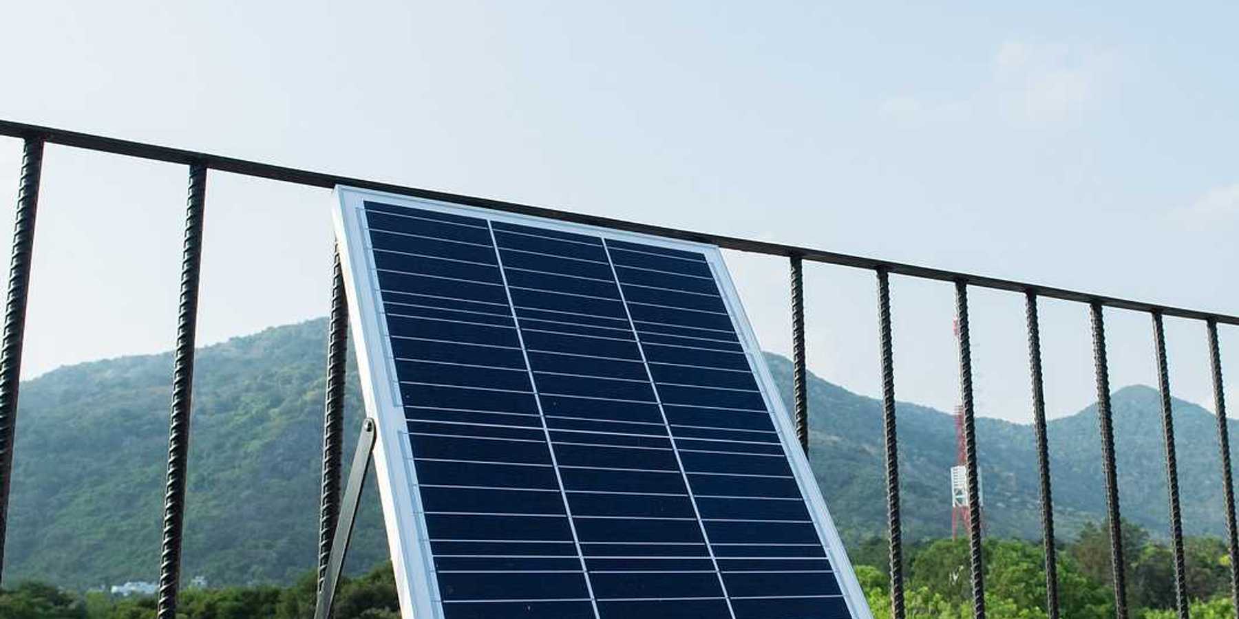 Plug-in solar panels mounted on a balcony terrace.