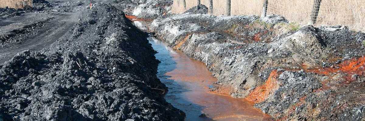 Polluted water adjacent to coal waste heap