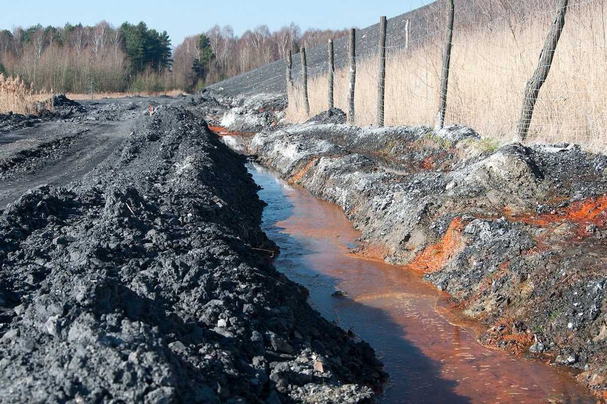 Polluted water adjacent to coal waste heap