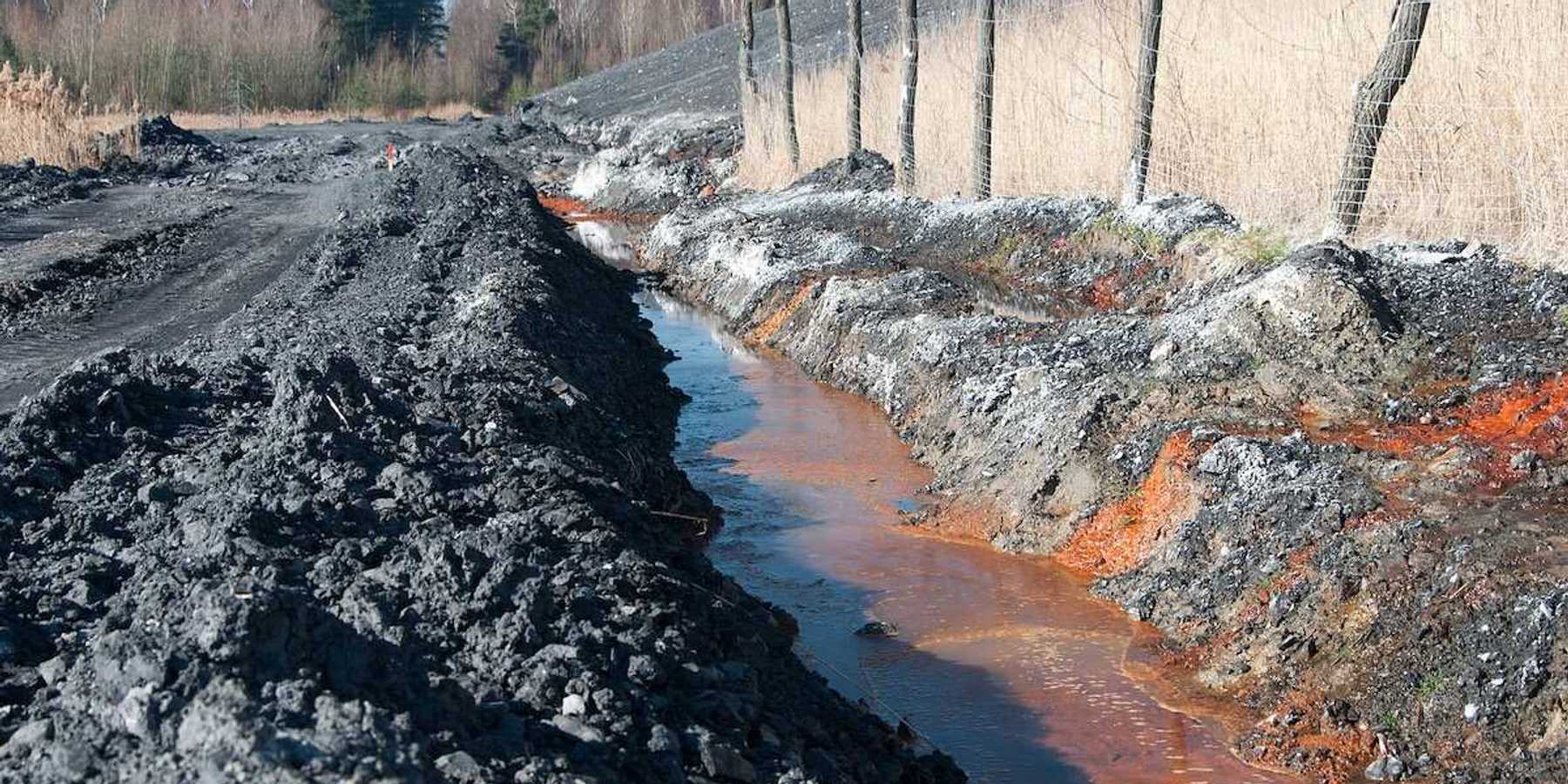 Polluted water adjacent to coal waste heap