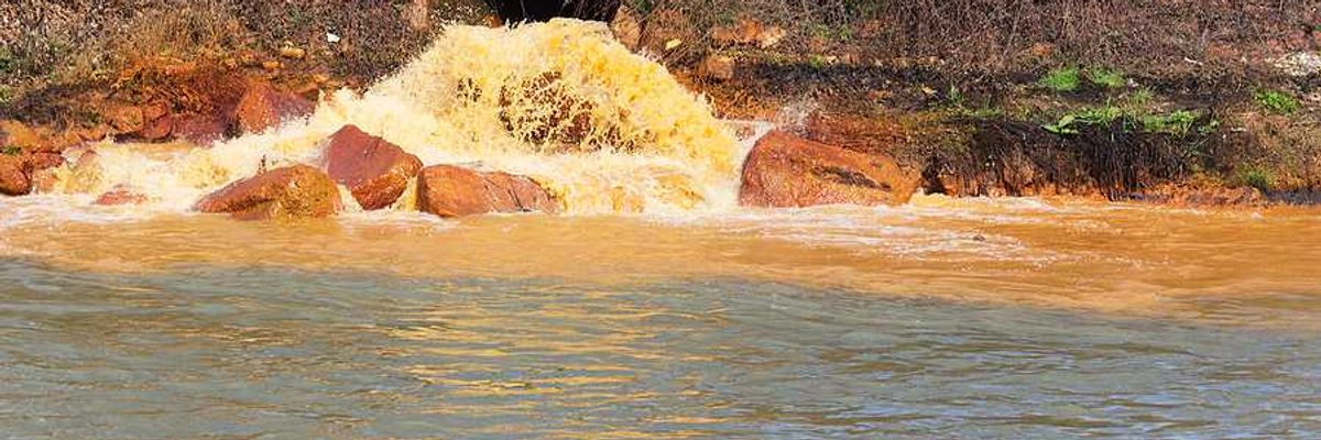 Polluted water coming from a pipe