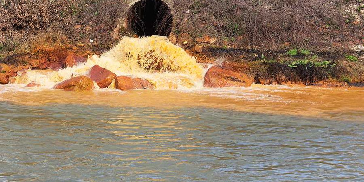Polluted water coming from a pipe