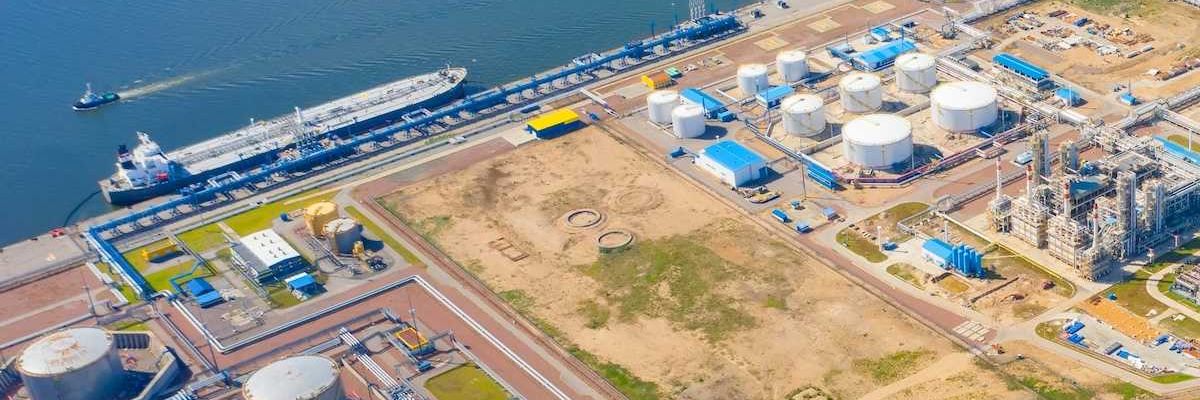 port refinery and petrochemical storage tanks adjacent to ocean