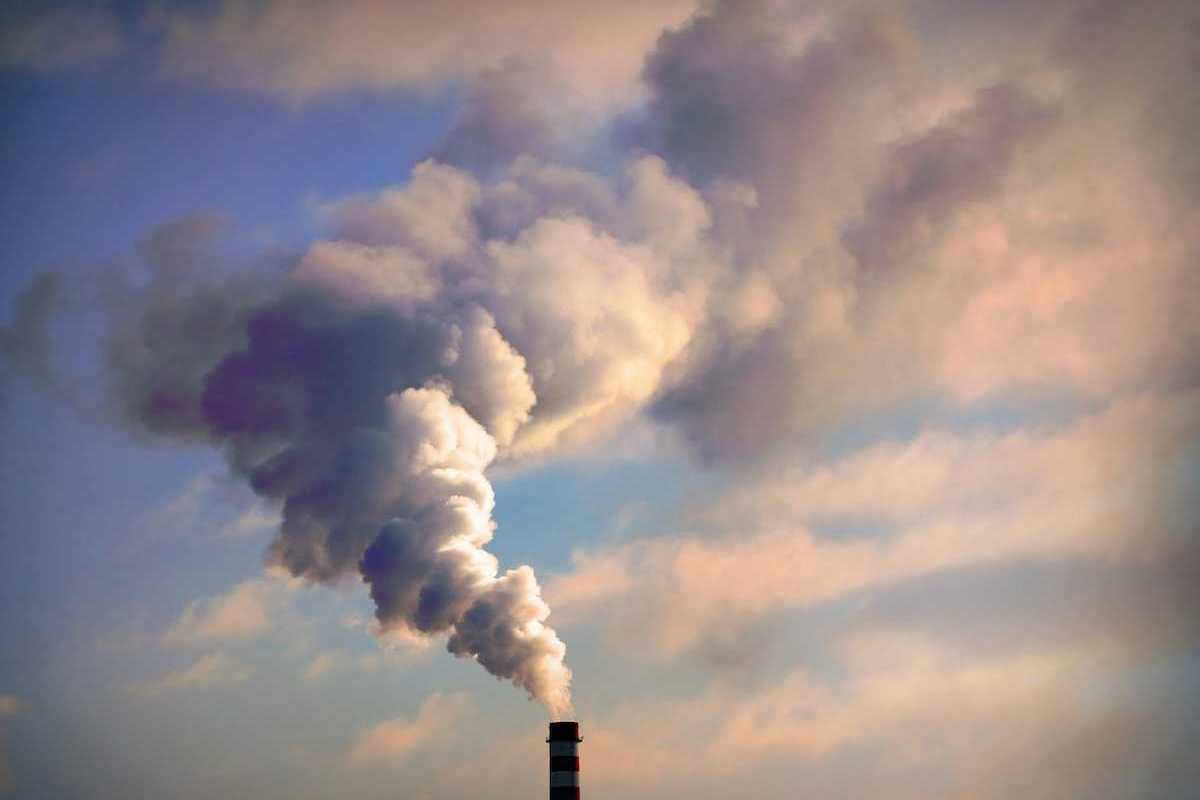 Power plant smokestack belching smoke