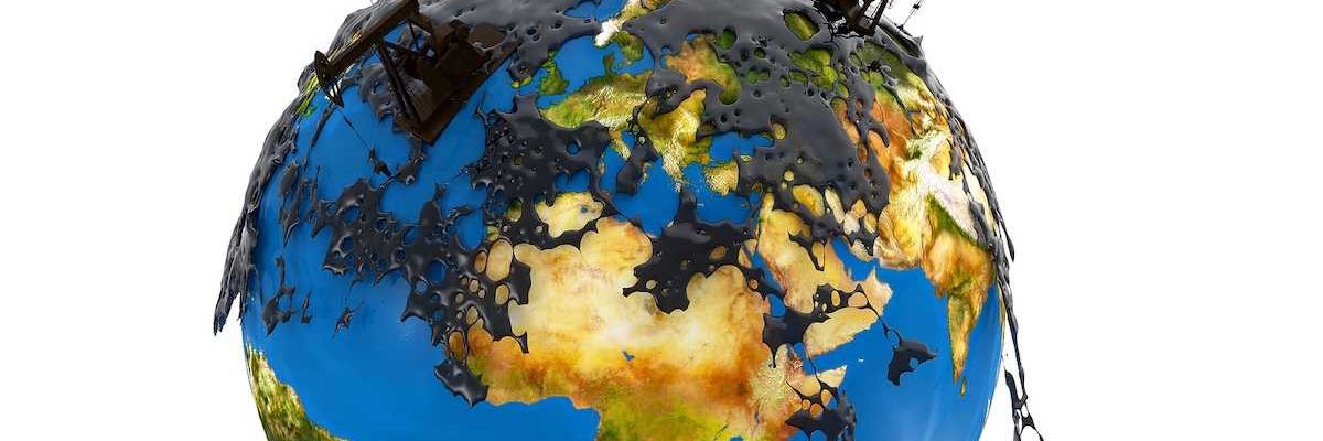 Pump jacks and oil spill over planet earth isolated on white background.