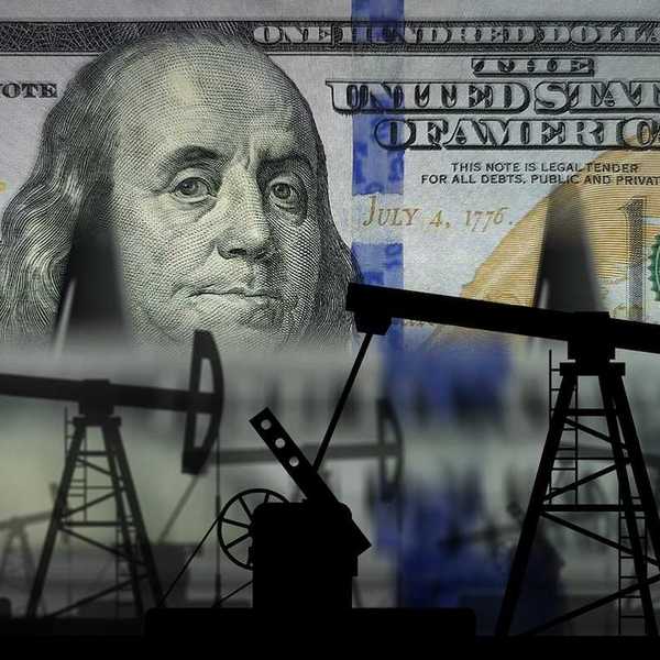Pumpjacks and fuel business superimposed on US one hundred dollar bank note.