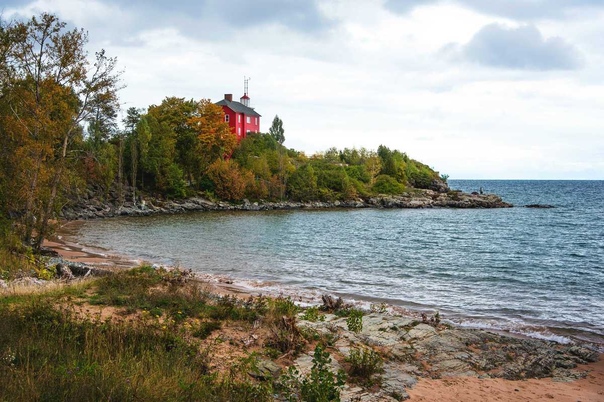 red and white building near body of water during daytime