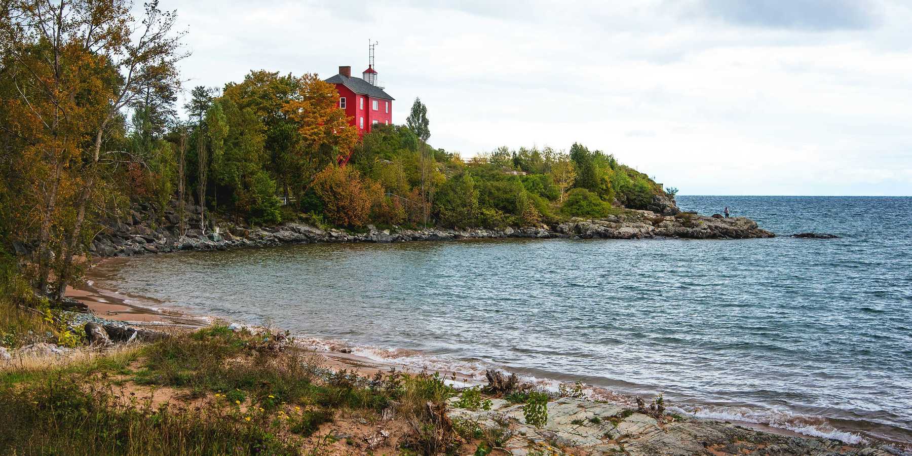 red and white building near body of water during daytime