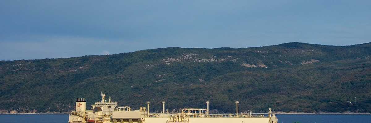 Red and white tanker with "LNG" printed on the side.