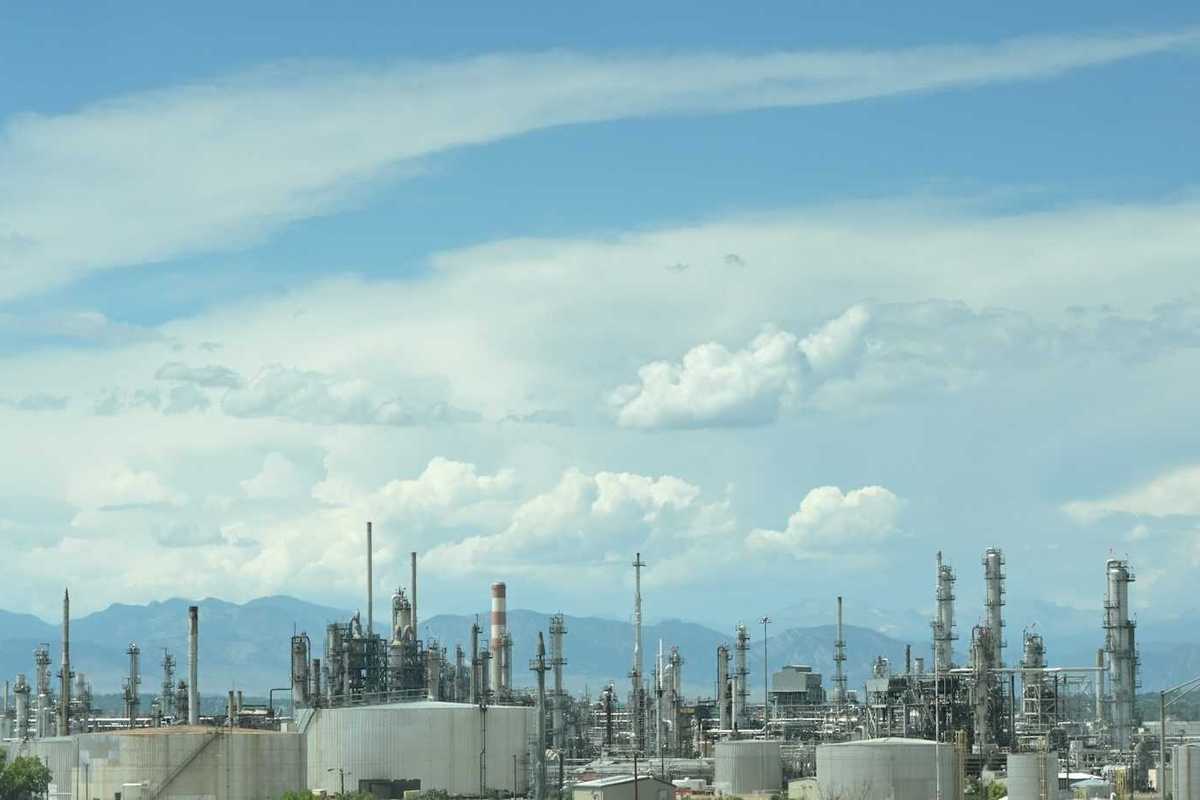 Refinery against a mountainous backdrop
