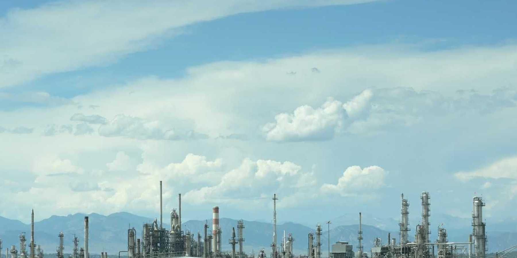 Refinery against a mountainous backdrop