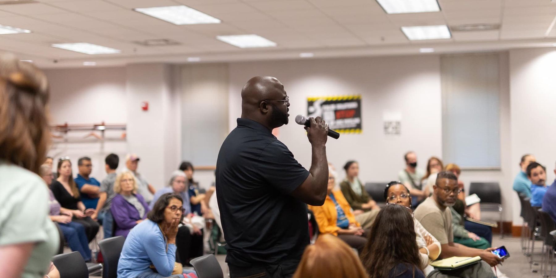 Resident speaks at an event about the Midwest hydrogen hub organized by Just Transition NWI.