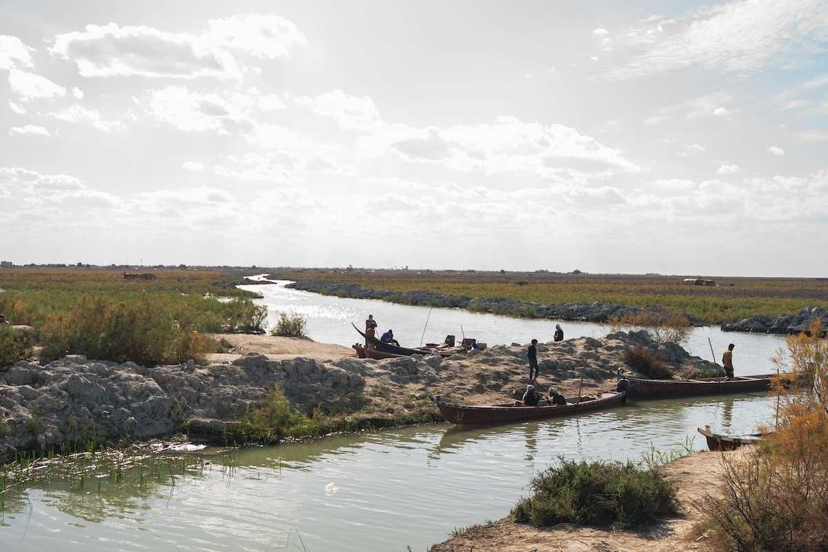River in Iraq with boats and boatmen