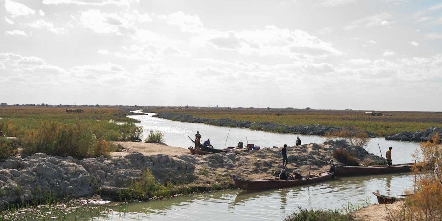 River in Iraq with boats and boatmen