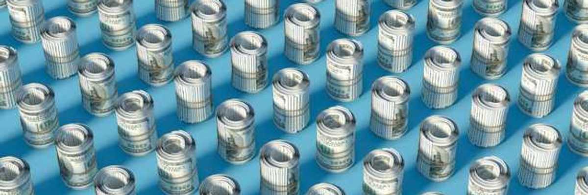 Rows of rolled up hundred-dollar U.S. bills on a blue surface