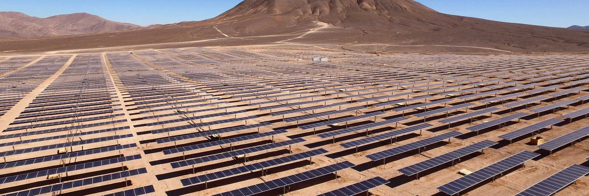 Rows of solar panels in a desert environment