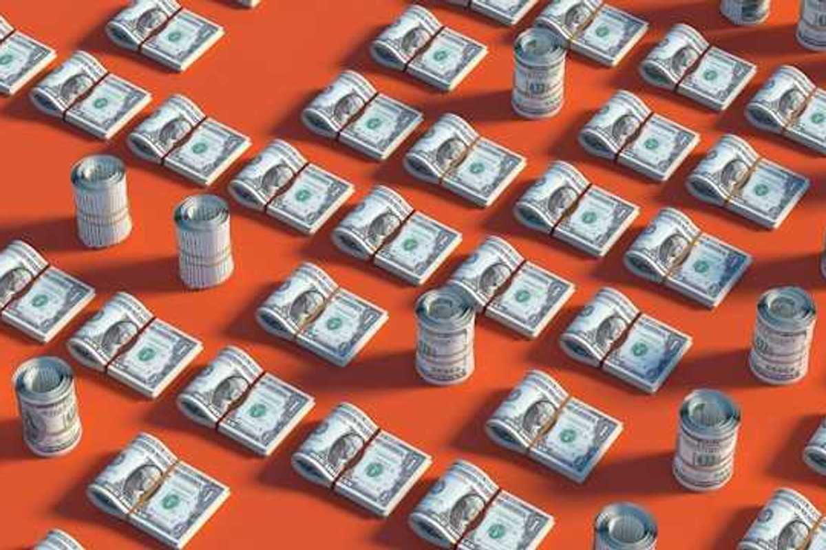 Rows of US dollars on a red background