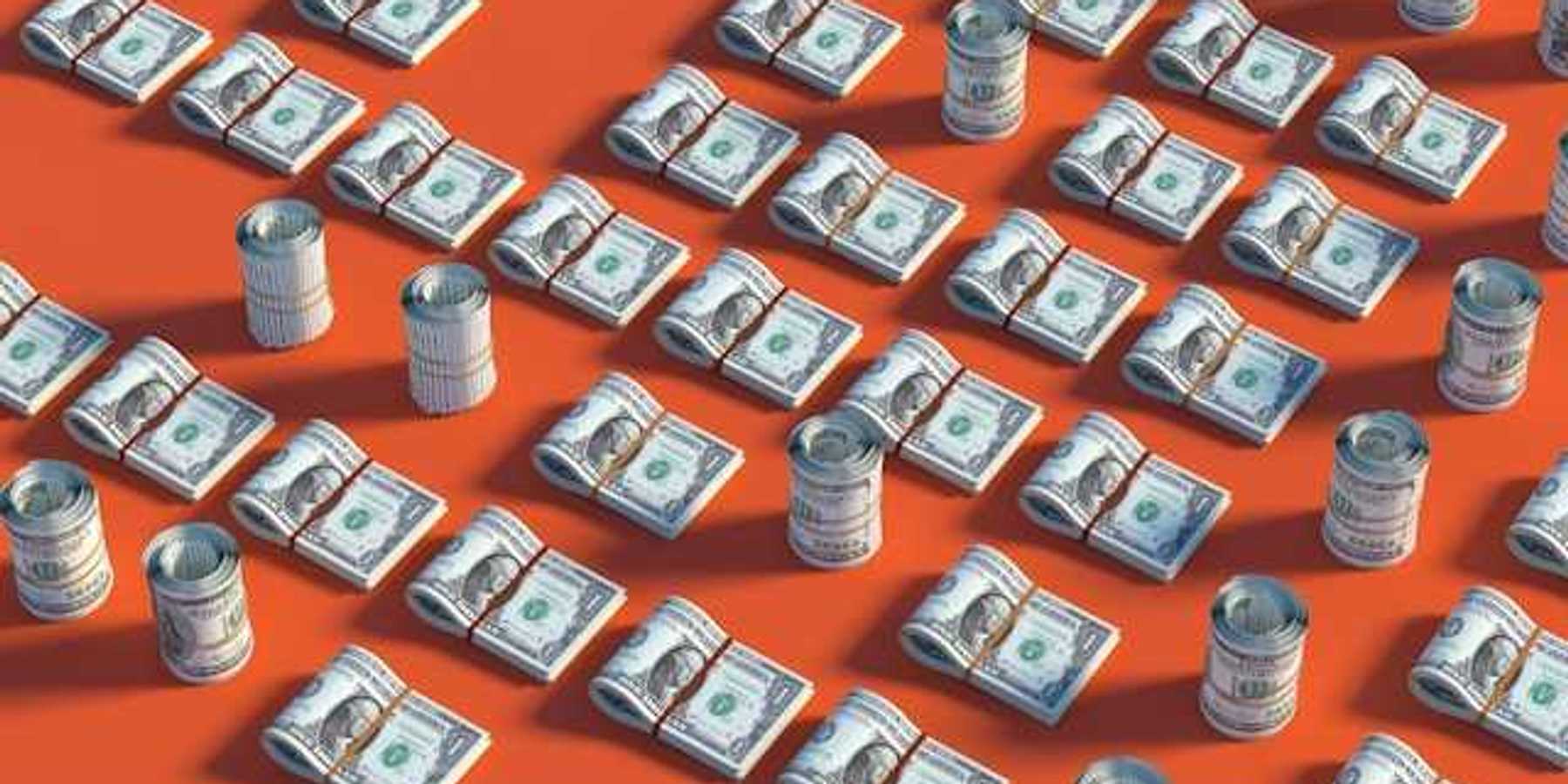 Rows of US dollars on a red background