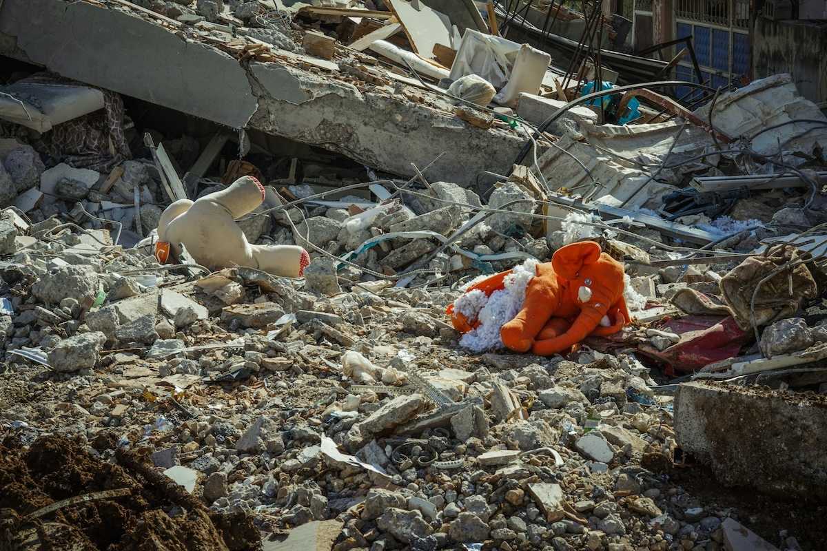 Rubble and stuffed child's toys in the aftermath of a destructive flood